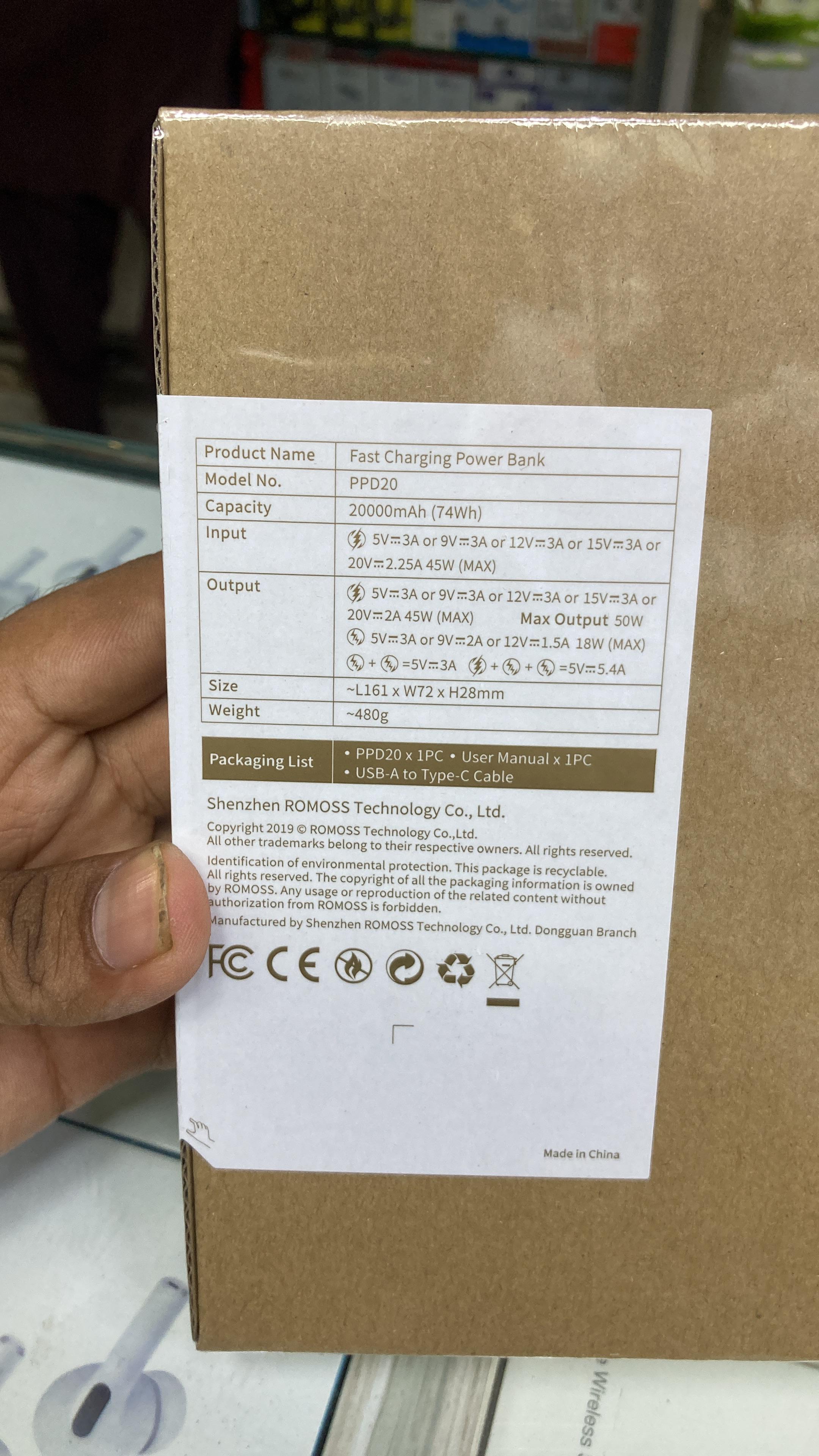 Back side of Romoss power bank cardboard packaging box showing product model PPD20 specifications and packaging list sticker.