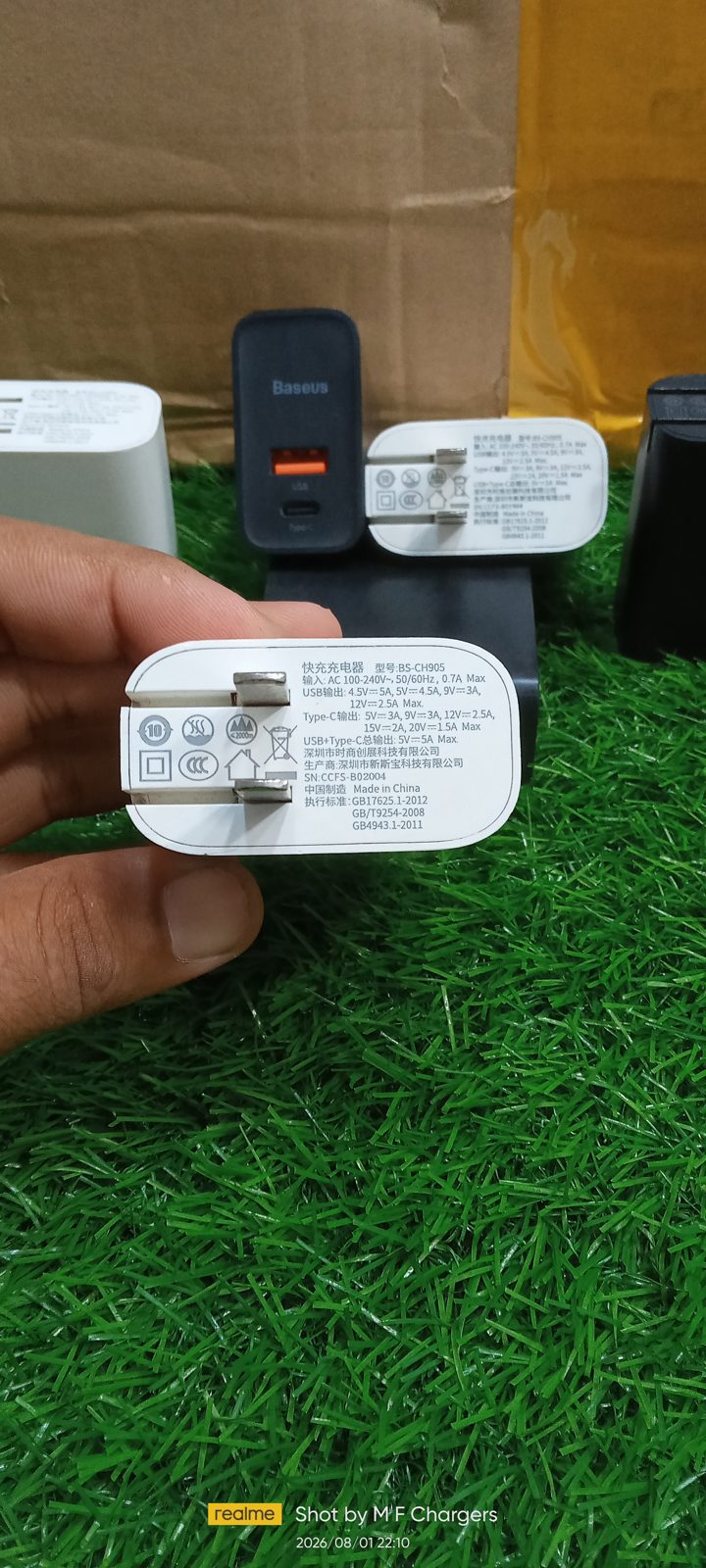 View of the power plug pins and technical details of the authentic Baseus 30W dual port charger from M F Chargers, suitable for Pakistani sockets.