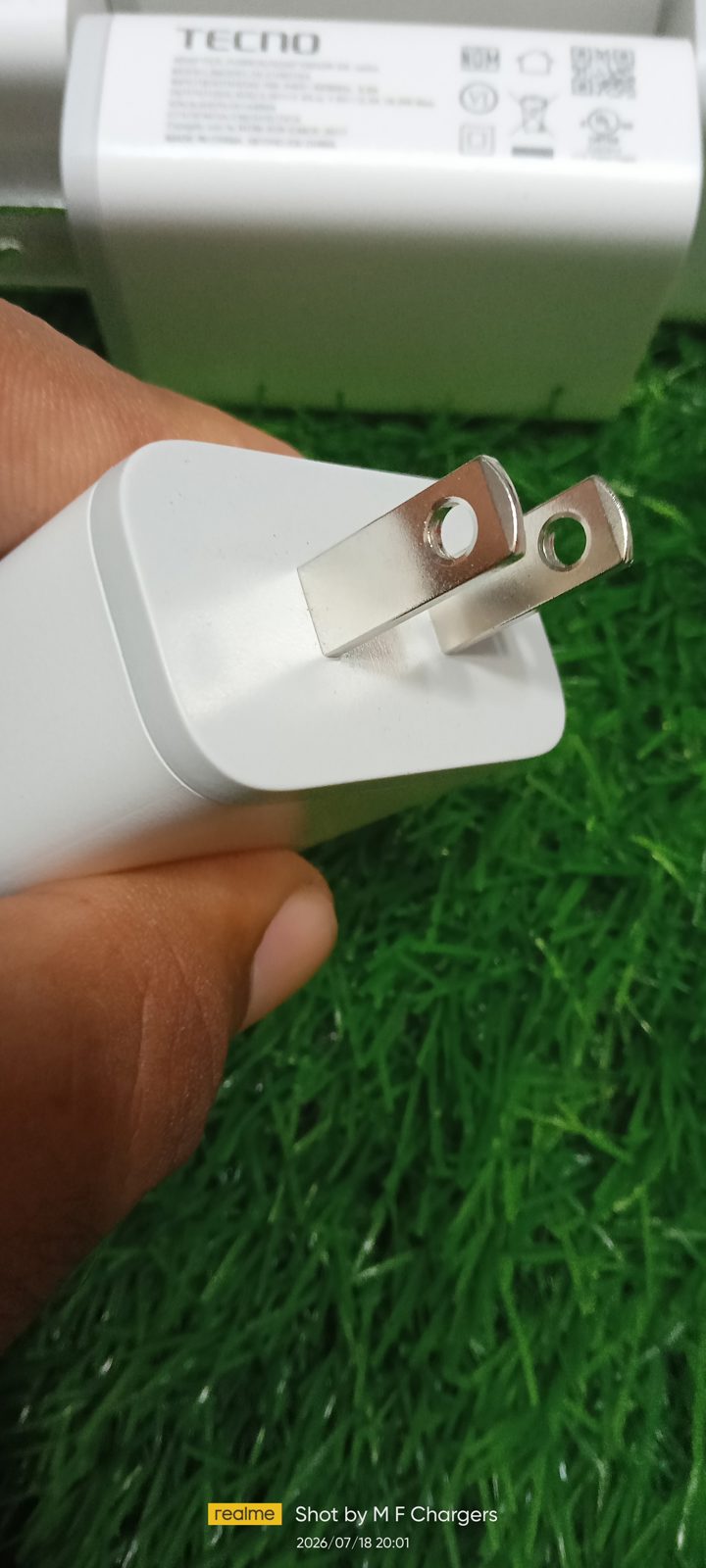 Genuine Tecno 18W fast charger two pin US plug close up shot by M F Chargers