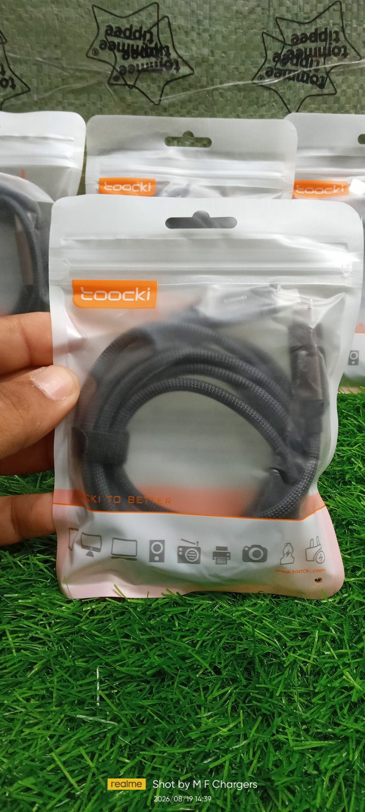 Toocki 240W Type-C Cable in sealed retail packaging on grass - M F Chargers