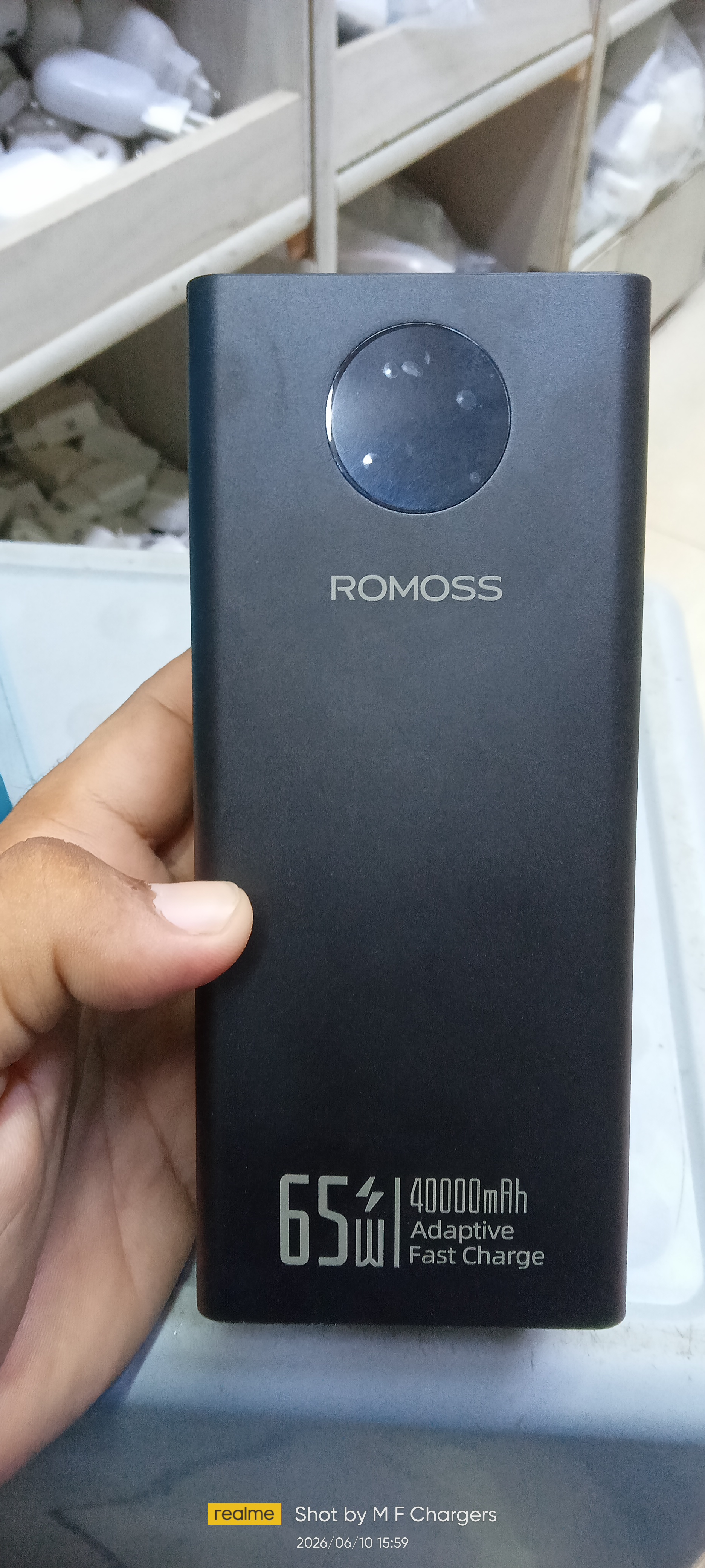 Front view of Romoss 65W 40000mAh high capacity power bank showing circular digital display screen and printed branding.