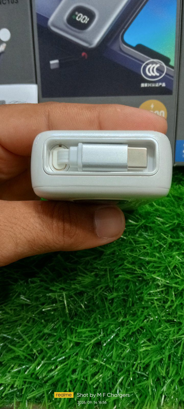 UPKU power bank built-in retractable cable connector close-up M F Chargers