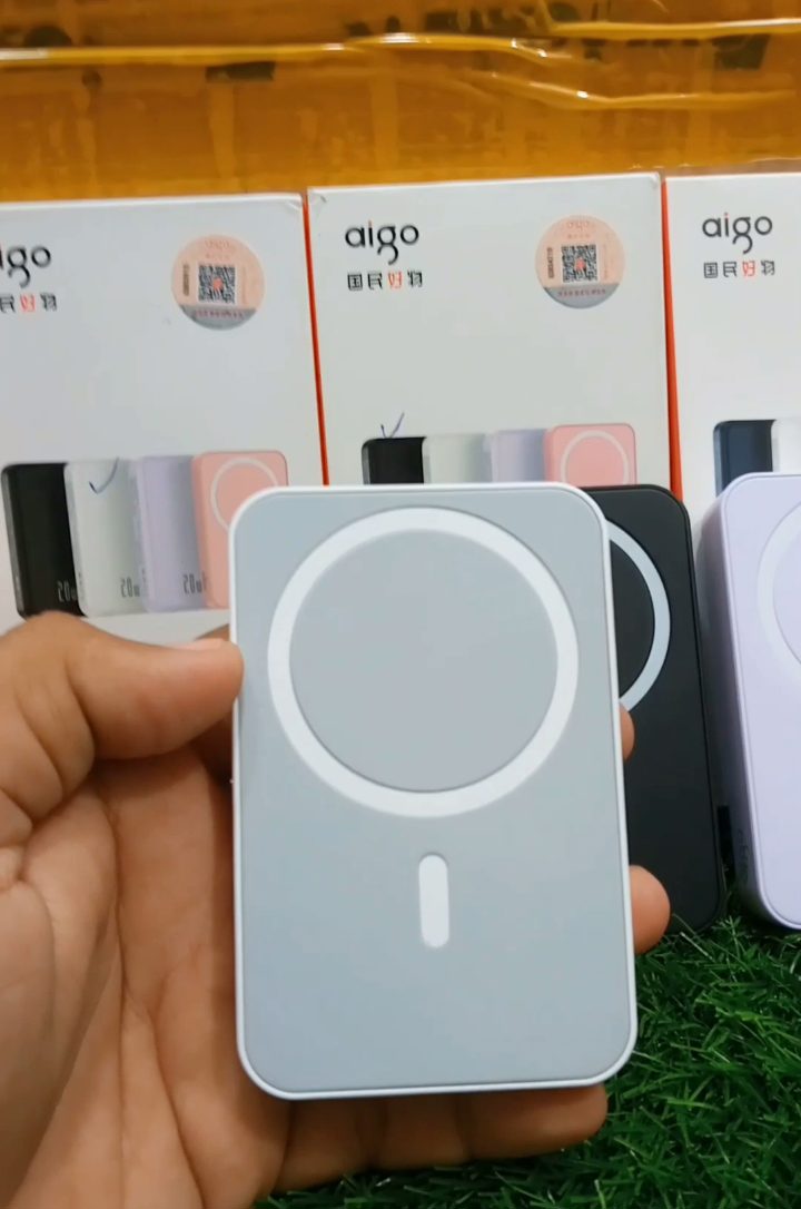 aigo 10000mAh wireless power bank in silver color variant held in hand - M F Chargers