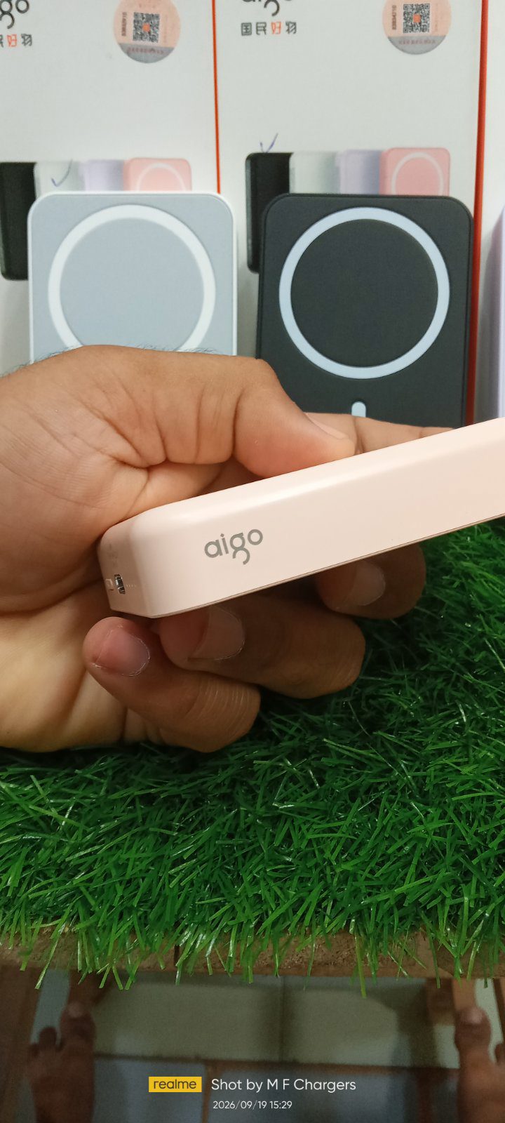 aigo A01 wireless power bank slim side profile view showing branding - M F Chargers