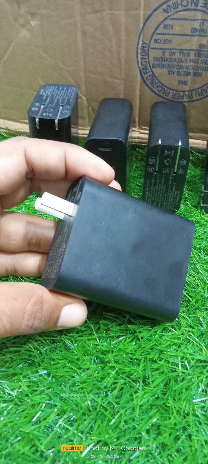 Hand holding original Baseus 60W multi-port fast charger for retail and wholesale - M F Chargers
