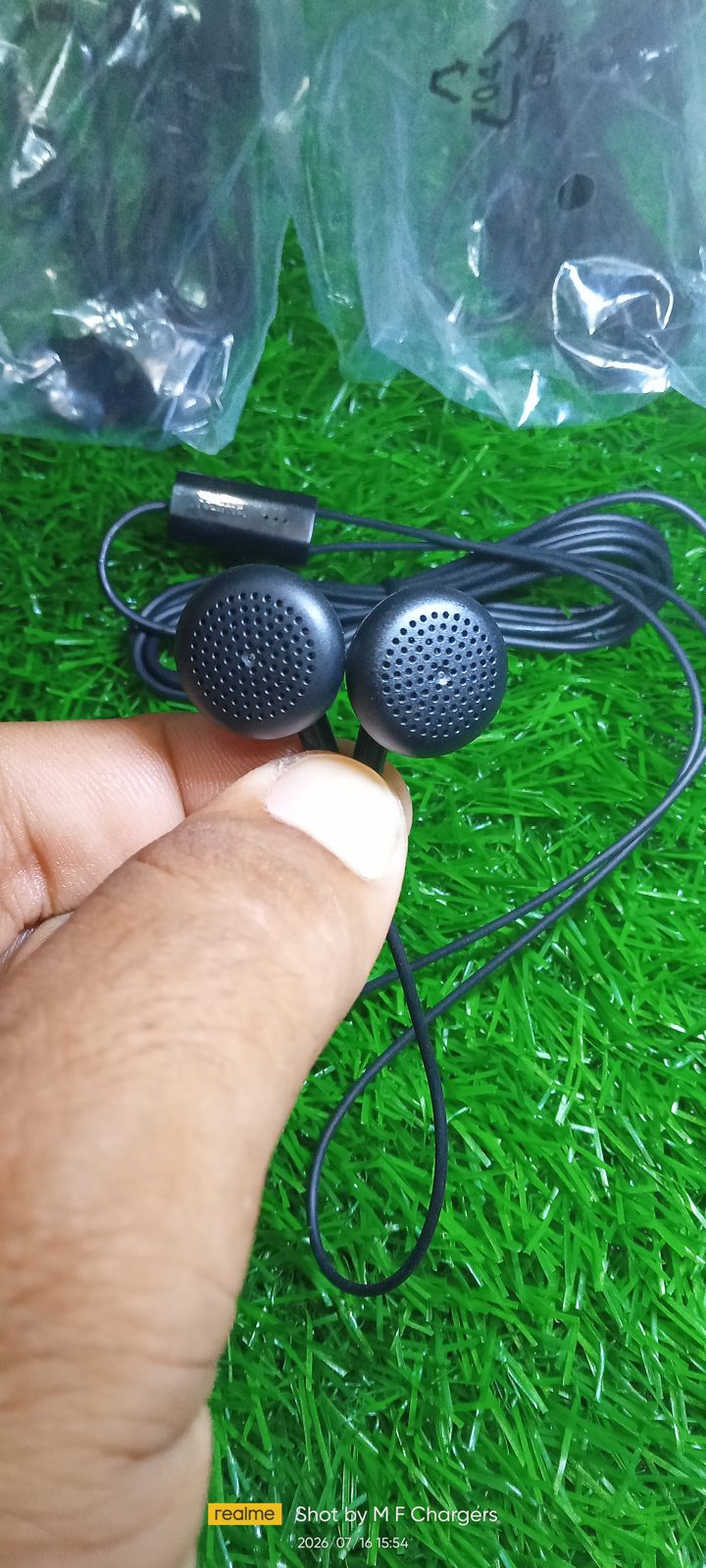Authentic Nokia WH-108 handsfree ear tips with classic design on green background - M F Chargers