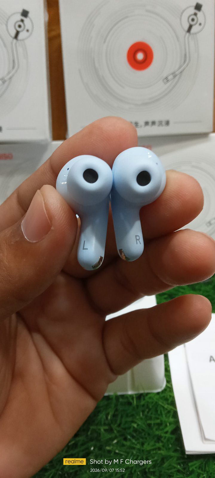 Miniso wireless earbud stick design close-up view - M F Chargers