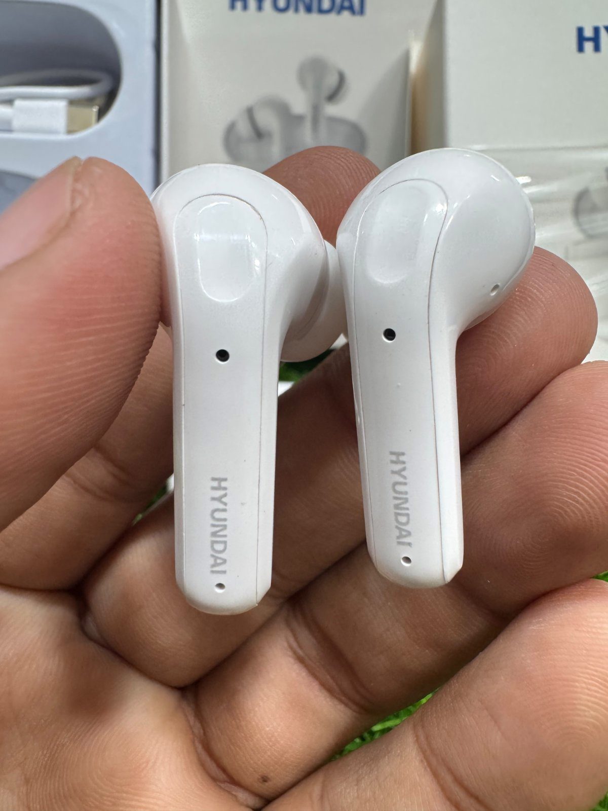 Hyundai HY-P02 touch control wireless earphones close up M F Chargers