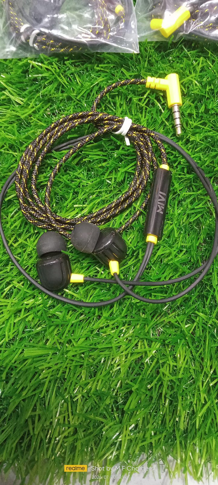 VIP MIVI Braided Earphones complete wire design lying on green grass display by M F Chargers