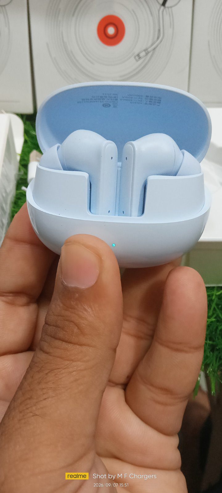 Open charging case showing Miniso wireless earbuds - M F Chargers