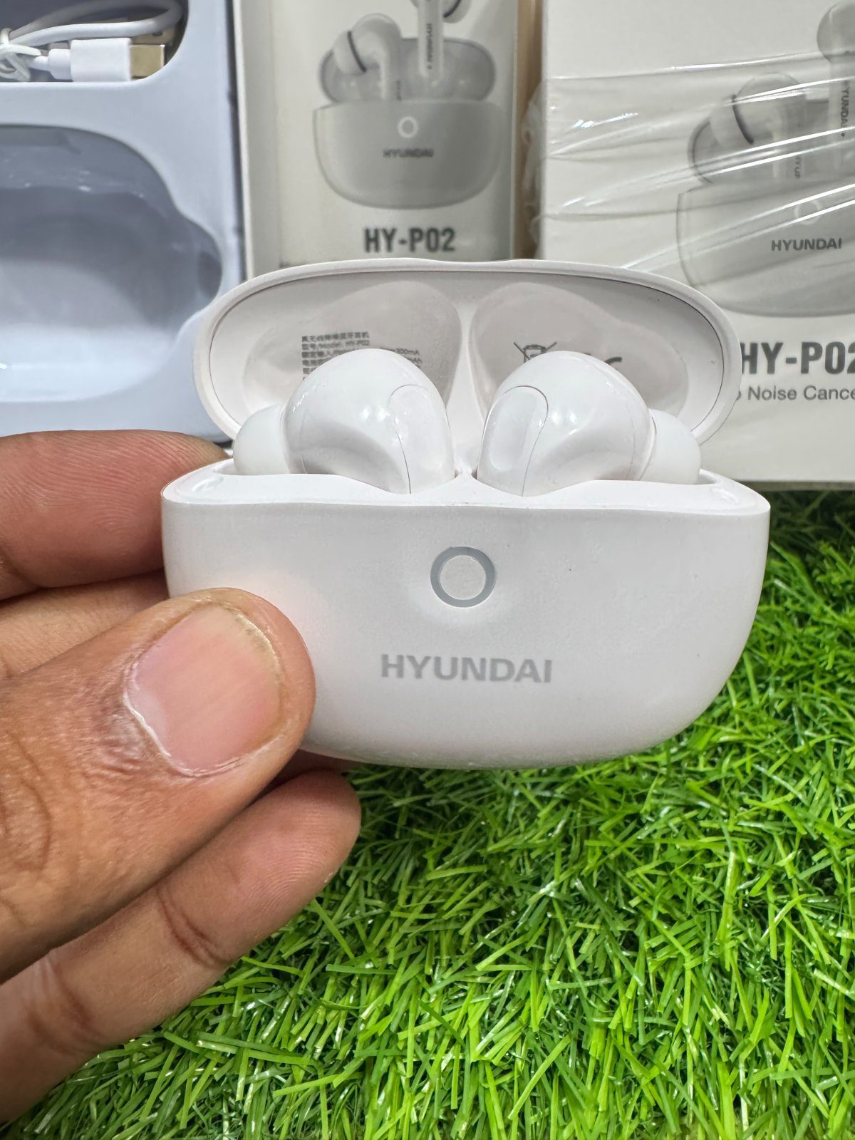 Hyundai HY-P02 TWS earbuds inside charging dock M F Chargers