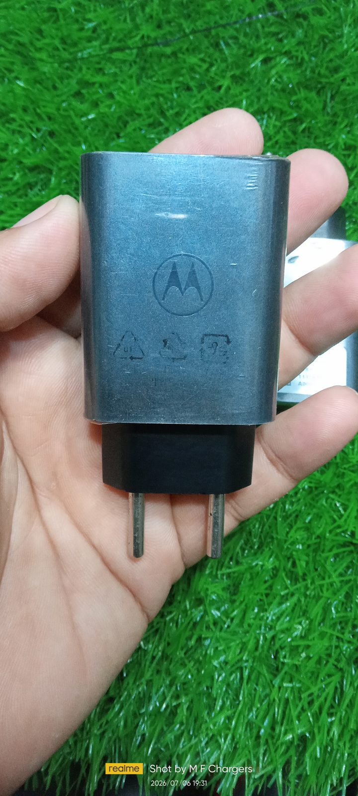 Motorola original turbo charging adapter back view showing genuine embossed M logo by M F Chargers